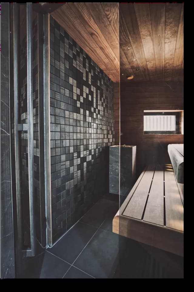 A sauna space with mosaic-pattern panels